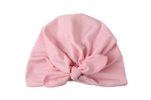 Detailed close-up of soft pink baby knot hat featuring an elastic cotton bow design