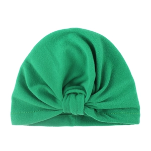 Bohemian style green knotted baby turban hat in breathable cotton for newborns and toddlers