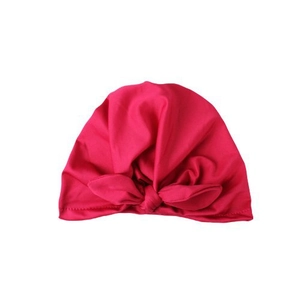 Rose pink baby turban hat with large rabbit ear knot made of soft elastic knit fabric