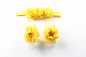 Detailed set of yellow chiffon flower headband and matching barefoot baby sandals