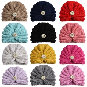 Knitted baby turban beanies with rhinestone flowers in twelve various solid colors