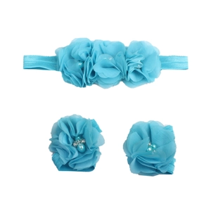 Macro detail of sky blue chiffon flower headband and matching baby barefoot sandals set