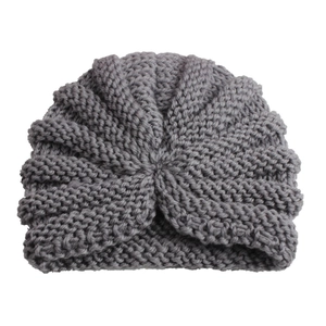 Detailed close-up of dark grey infant turban knit hat featuring center spiral twist design