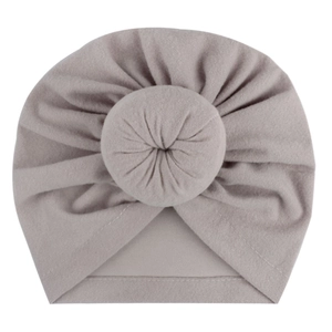 Detailed view of grey baby knot turban hat with soft knitted texture and donut knot