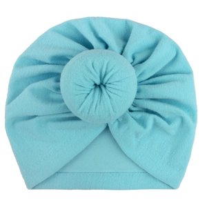 Soft light blue baby turban hat with a signature donut knot and knitted pleats