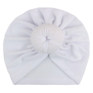 Detail of white newborn turban hat featuring a central soft knotted design and ribbed fabric