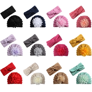 Detailed view of 12-color knitted baby turban hat and bow headband sets in a grid display