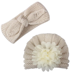 Detail of baby beige knit set with oversized mesh flower hat and bow headband