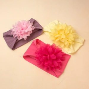 Three-pack wide nylon headbands for baby girls featuring large layered chiffon flowers