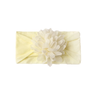 Creamy yellow baby nylon headband featuring a large layered fabric floral embellishment
