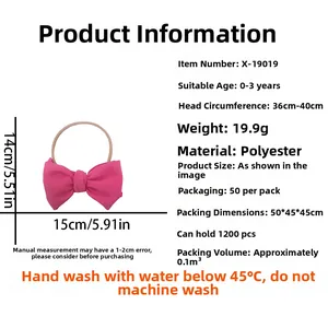 Detail showing fuchsia baby nylon headband with bow and texture on white background