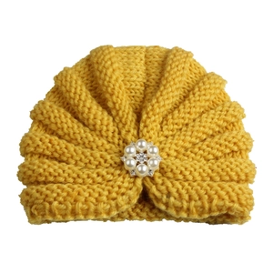 Bright yellow knit baby beanie with rhinestones and faux pearls flower ornament