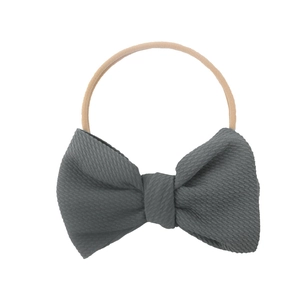 Close-up of soft waffle texture grey bow and high-elastic nylon baby headband detail