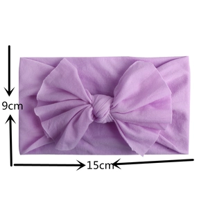 Detail view of purple soft nylon infant headband with 15cm wide bow knot and size markers