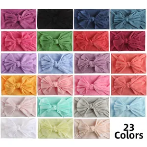 Detailed grid view showing 23 colors of soft nylon baby headbands with large bows