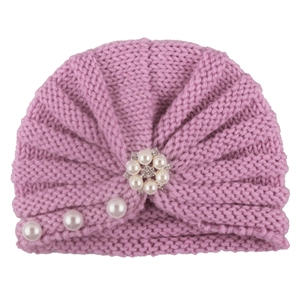 Pink knit baby turban hat with decorative pearl flower and soft textured finish