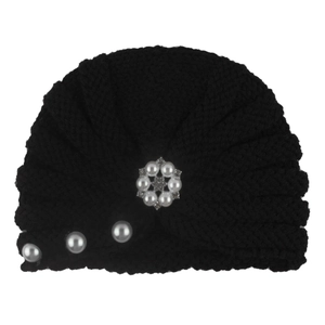 Detailed knit texture of black baby turban hat with elegant pearl and rhinestone accents
