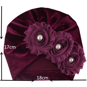 Detailed view of dark red velvet baby turban hat with 18cm width and 17cm height dimensions