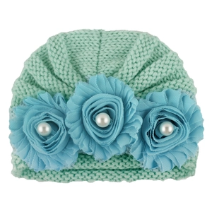Infant knit turban hat in mint green with light blue floral accents and pearl detail
