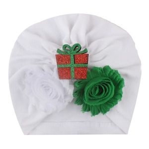 White baby Christmas turban with sequined gift box and festive fabric flowers