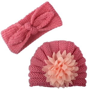 Pink knit baby hat with mesh flower and matching bow headband set for infants