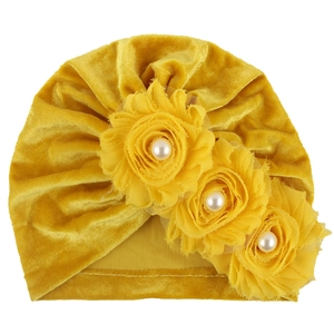 Ginger yellow velvet baby turban hat with three fabric flowers and white pearl accents