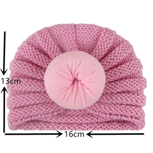 Pink knit baby turban hat with donut knot detail, showing 13cm height and 16cm width size