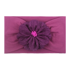 Bandeau élastique souple pour bébé en magenta avec une grande fleur décorative