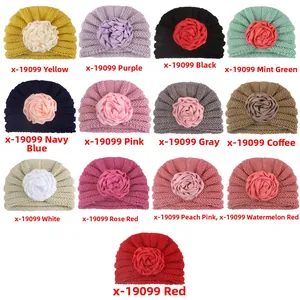 Multiple color options of soft knit baby beanies featuring large handmade fabric flowers