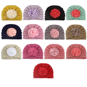 Knit baby beanie with large flower detail in 13 colors for autumn and winter warmth