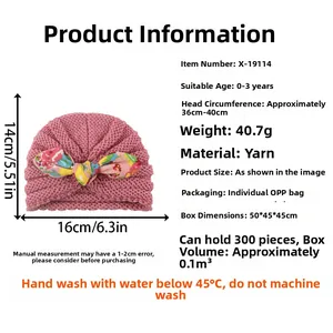 Pink infant turban hat with floral bow detail and size specification info