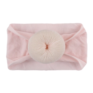 Bandeau bébé en nylon rose clair avec un nœud décoratif rond et texturé en relief