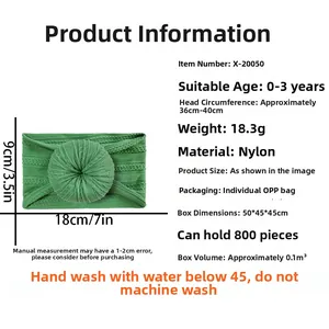Green nylon baby headband with donut knot detail, sizing 36-40cm for infants 0-3 years
