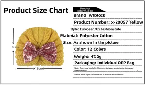 Detailed view of yellow knit baby hat with pink sequin bow and material specifications