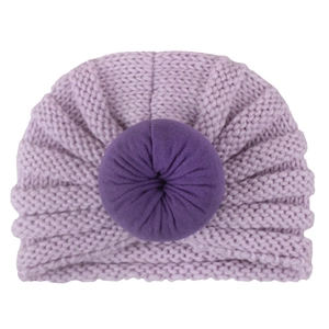 Soft knitted purple baby turban hat with donut knot for winter warmth and comfort