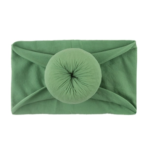 Bandeau souple en nylon pour bébés avec nœud style donut de couleur vert herbe