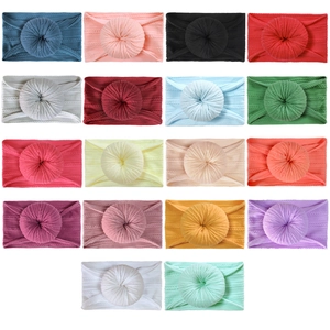 Set of 18 nylon infant headbands with soft donut knots in various trendy colors