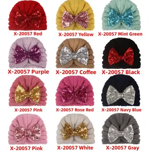 Detailed grid view of 12 colors of baby knitted hats with sequin bow decoration