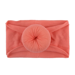 Bandeau souple en nylon corail pour bébé avec un nœud décoratif rond et doux