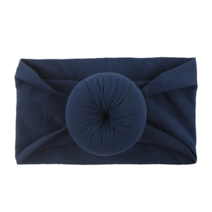 Bandeau bébé bleu foncé en nylon avec tissu doux et design décoratif de nœud donut