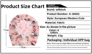Pink floral baby hat featuring a large 3D flower decoration and 19cm by 17cm dimensions