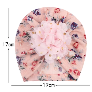 Pink floral baby turban cap featuring a large 3D mesh flower with gold foil dots and dimensions