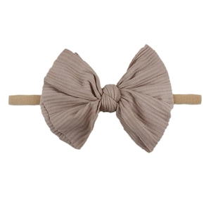 Bandeau bébé côtelé doux avec grand nœud de couleur beige pour le style des enfants