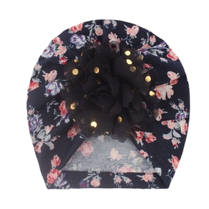 Infant head wrap with dark pink floral print and large black mesh flower with gold sequins