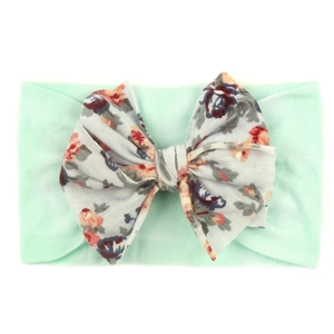 Bandeau élastique vert menthe pour bébé avec un grand nœud à fleurs vintage