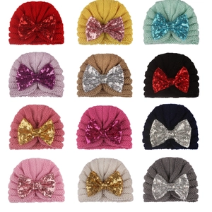 Knitted baby beanie set with large sequin bows in twelve colorful assortments for winter
