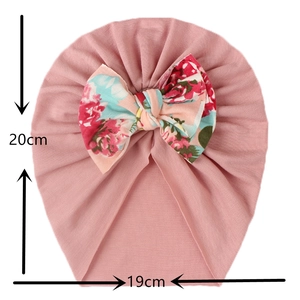 Detailed size chart for pink baby turban hat with floral bow showing 20cm by 19cm dimensions