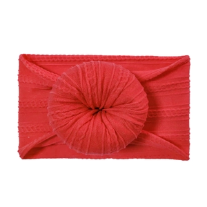 Elastic baby nylon headband featuring a bright red donut knot and cable knit texture