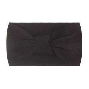 Detail view of a soft black nylon headband for babies featuring a stylish double knotted bow