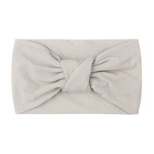 Detailed view of soft light grey knotted nylon baby headband with fine fabric texture